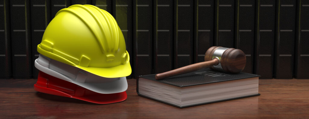 Labor, Construction Law. Safety Helmet And Judge Gavel On Wooden Table